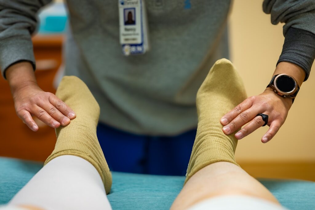 A nurse checks my circulation and pulse in my feet before taking me back for knee replacement surgery (right knee) at Portneuf Medical Center in Pocatello, Idaho, on April 28, 2025.